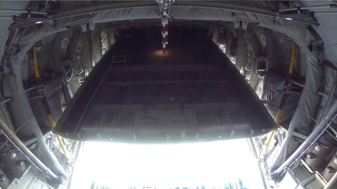 The cargo door of a C-130 opening and preparing cargo for aerial drop - 2015 Stock Footage 107537975