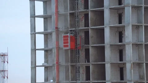 Cargo elevator on the construction of a house, cargo lift Stock Footage 231211451