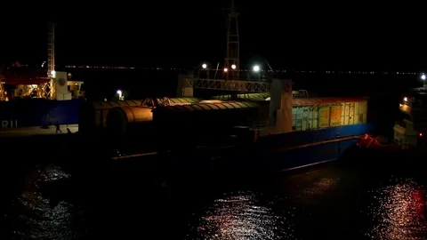 Cargo ferry approaches the pier at night Stock Footage 84547535
