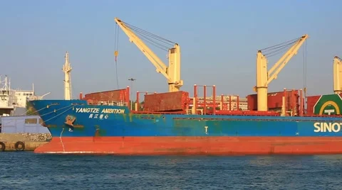 Cargo freight ship with large deck cranes in shipyard for logistics export Stock Footage 42654254