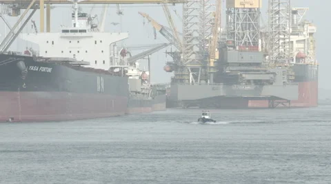Cargo Freight Ships With Working Crane Stock Footage 65338070