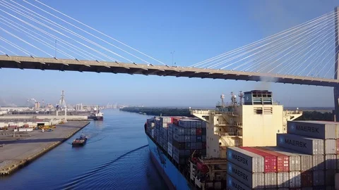 Cargo Freighter Approaches Seemingly Low Bridge at Port of Tampa Stock Footage 128210770