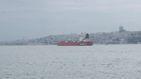 The cargo freighter is passing through Istanbul, the Bosporus. Stock Footage 274957584