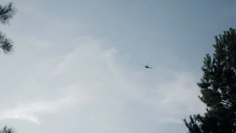 Cargo helicopter flies high in the sky Stockbeeldmateriaal 122277228