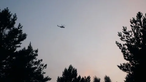 Cargo helicopter flies high in the sky Stock Footage 122348384
