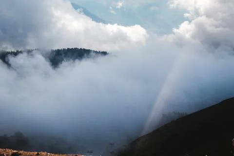 Cargo helicopter hovered in great clouds obmnyh Stock Photos