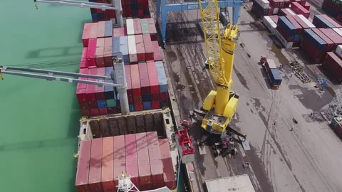 Cargo loading at a busy port with cranes and colorful containers Stock Footage 318205992