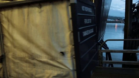 Cargo offloads from a ship. Stock Footage 70337495