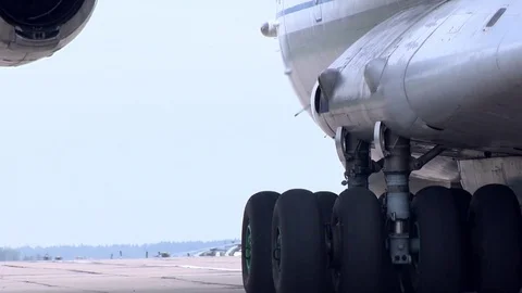 A cargo plane at the airport is preparing to take off from the runway. Military  Stock Footage 82909220
