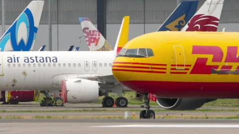 Cargo plane Boeing 767 of DHL taxiing, side view Stock Footage 290780824