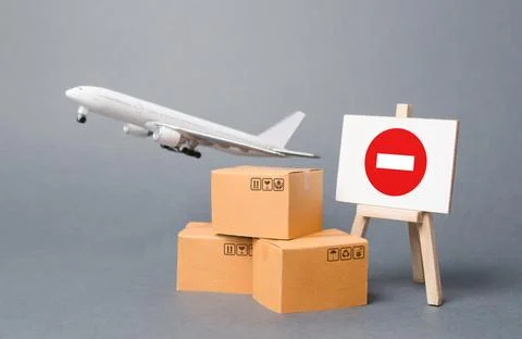 Cargo plane with boxes and an easel with a restriction sign. Restrictions o.. Stock Photos