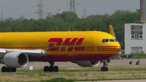 Cargo plane DHL on the runway Stock Footage 314619356