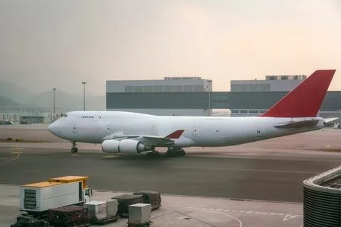 Cargo plane double decker fuselage without windows taxiing along the apron .. Stock Photos