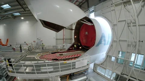 Cargo plane on the unloading platform of an aircraft manufacturer Stockbeeldmateriaal 166356396