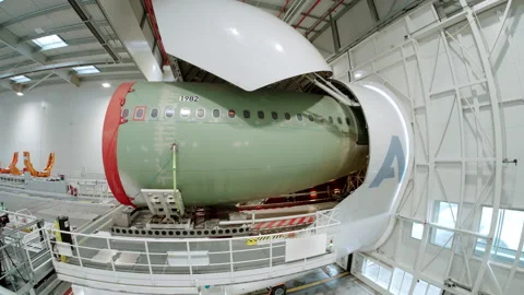 Cargo plane on the unloading platform of an aircraft manufacturer Stockbeeldmateriaal 166356862