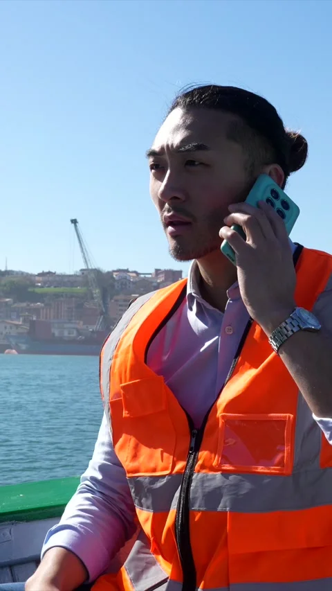 Cargo port worker talking on the phone Stock Footage 333731521