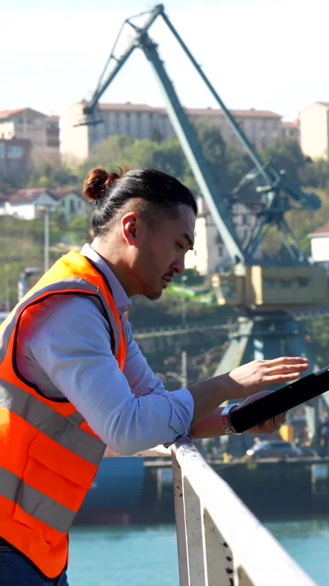 Cargo port worker using tablet at dock Stock Footage 333731500