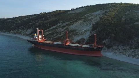 Cargo ship aground after storm in sea, aerial view Video stock 126589256