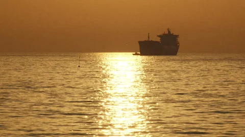 Cargo ship and a beautiful sunset Stock Footage 30841955