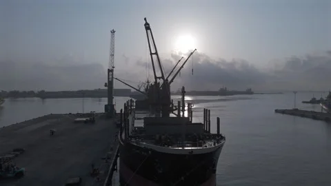 Cargo ship and dockside cranes at Port of Veracruz in morning light Stock Footage 345184124