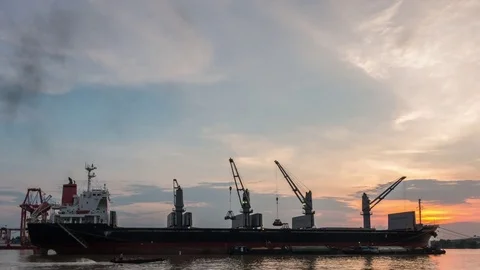 Cargo ship are loading sugar into the bilge with sunset. Stock Footage 81397860