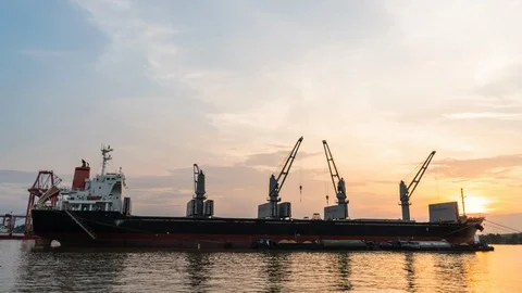 Cargo ship are loading sugar into the bilge with sunset. Stock Footage 103041074