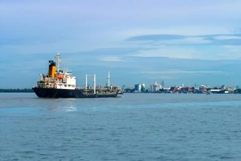 Cargo Ship Back to the pier Stock Photos