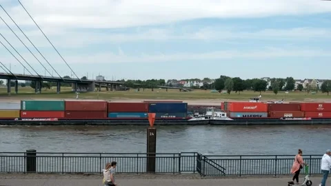 A cargo ship, a barge with containers goes along the North Rhine River Video stock 219884745