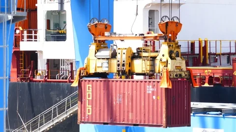 Cargo ship being loaded with container 4k Stock Footage 91063481