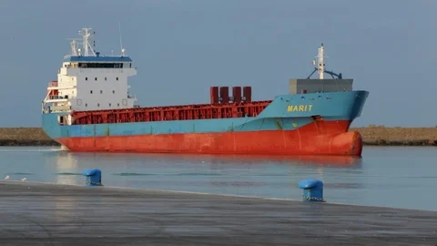 Cargo ship berthing in small port Stock Footage 108635210
