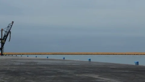 Cargo ship berthing in small port Stock Footage 108635238