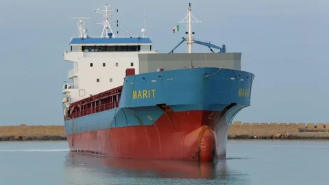 Cargo ship berthing in small port Stock Footage 108635249