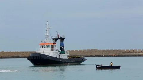 Cargo ship berthing in small port Stock Footage 108635267