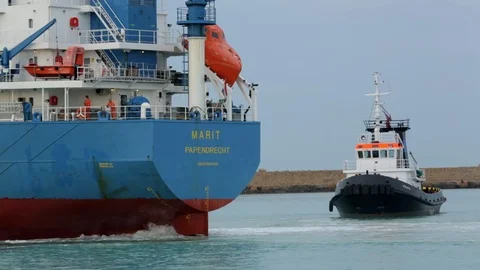 Cargo ship berthing in small port Stock Footage 108635286