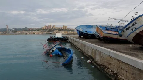 Cargo ship berthing in small port Stock Footage 108635292