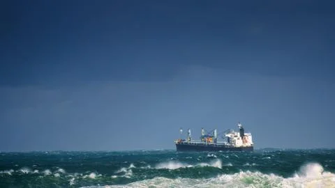 Cargo ship with big waves Stock Photos