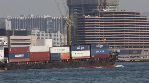 Cargo ship carrying containers drives at Victoria Harbour Stock Footage 45409677