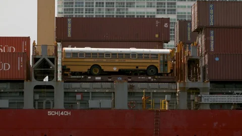 A cargo ship carrying containers sails in the ocean Stock Footage 117753497
