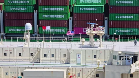 Cargo ship carrying multiple Evergreen and ONE branded containers docked at the Vídeo Stock 331324638