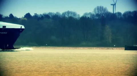 Cargo ship close up and windmill Stock Footage 20486643