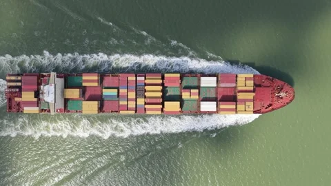 Cargo Ship With Colorful Containers on a Green Ocean Stock Footage 346422844