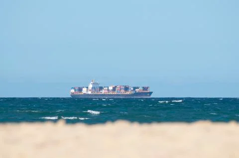 Cargo ship with container freight on the australian Sea Stock Photos
