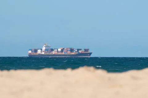 Cargo ship with container freight on the australian Sea Stock Photos