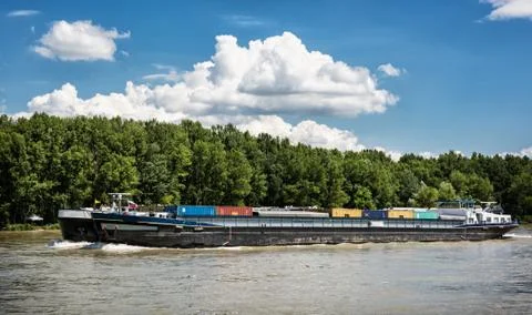 Cargo ship with containers on the Danube river, Slovakia Stock Photos