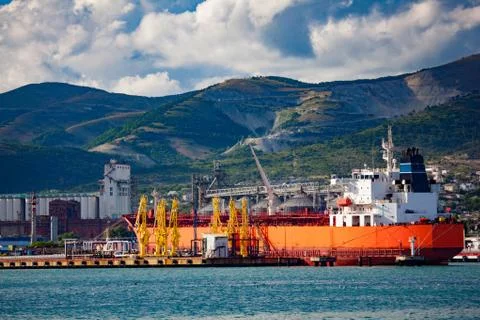 Cargo ship with containers in seaport Stock Photos