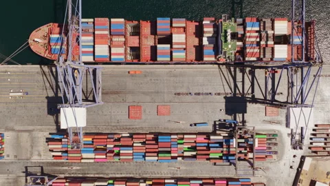 Cargo ship containers spelling the word help at port Stock Footage 345007117