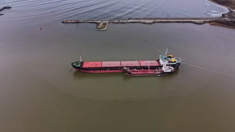 Cargo ship docked at shipyard for transport preparation tasks Stock Footage 337940800