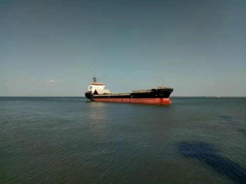 Cargo Ship docking in harbor 写真素材