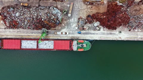 Cargo ship docks at recycling facility to unload materials in early morning 스톡 동영상 341107039