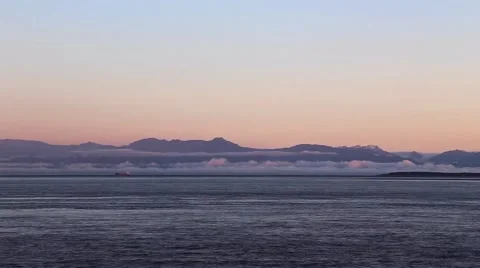 Cargo Ship Drifts with the Rolling Fog Across the Water Stock Footage 62493473